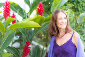 Intimacy Coach Deva Dasi with red ginger plants on Maui Intimacy Coach Deva Dasi with red ginger plants on Maui
